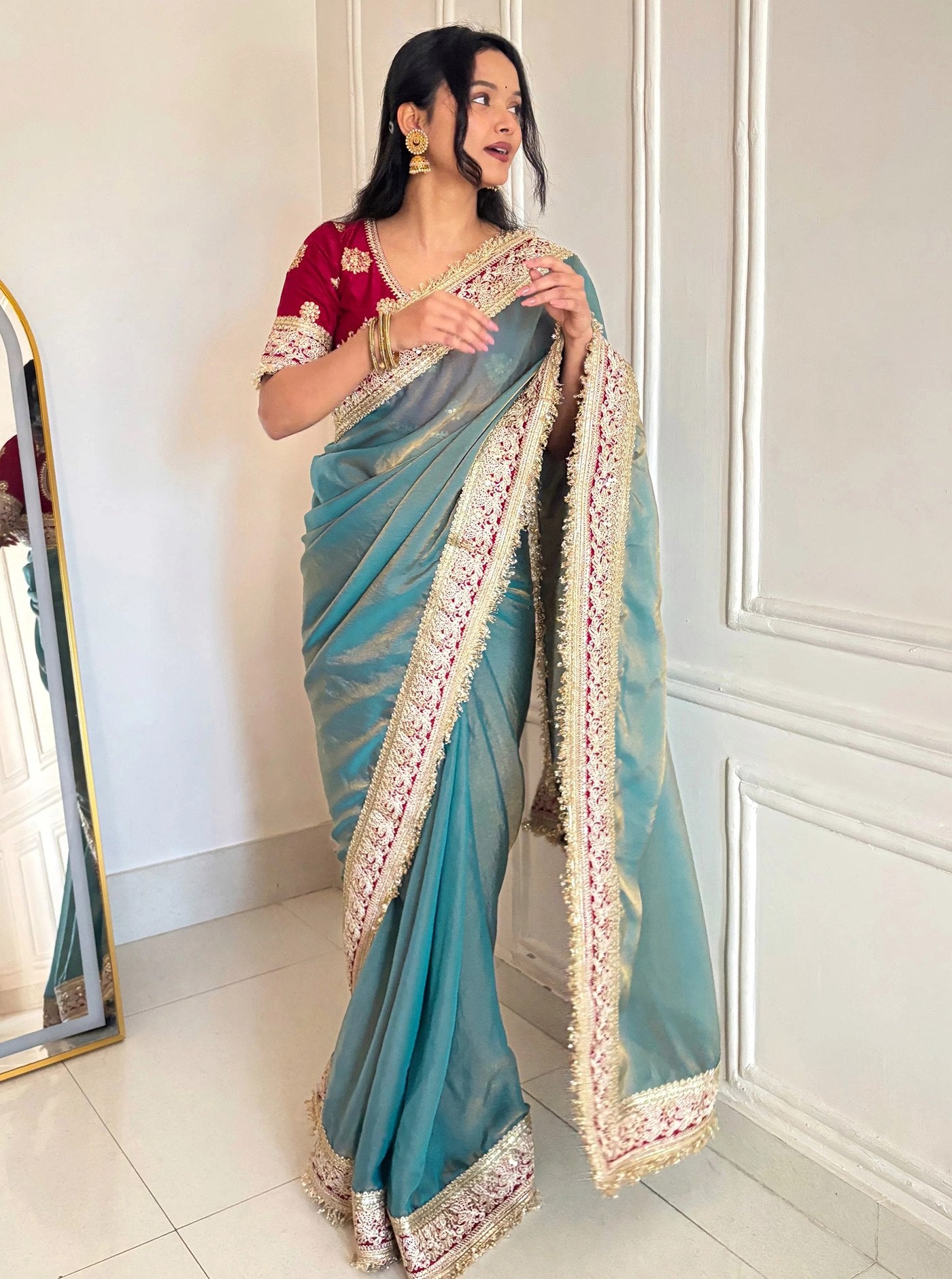 Elegant Teal Designer Saree with Heavy Embroidered Border & Red Blouse